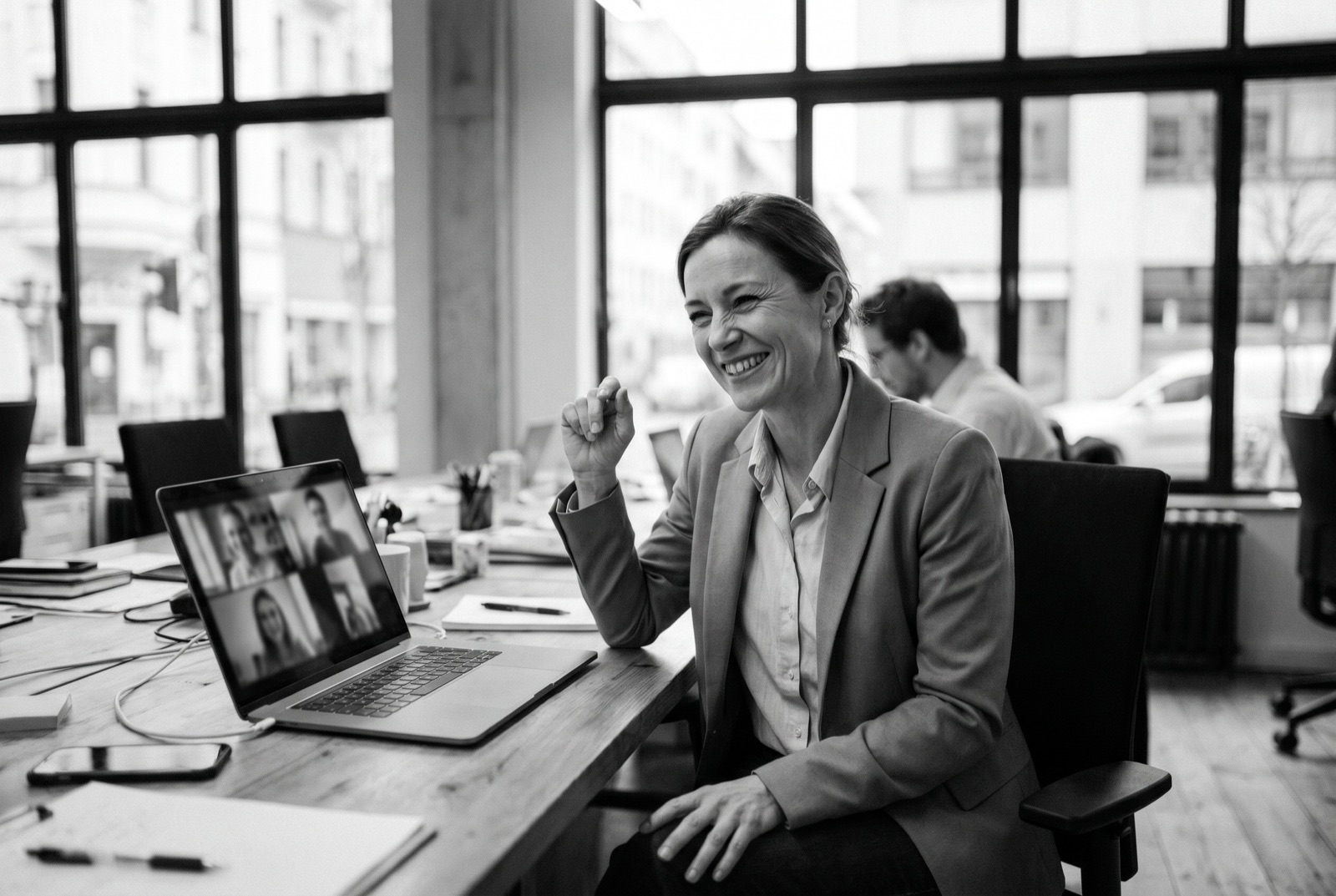 A friendly professional on a video call in a bright office