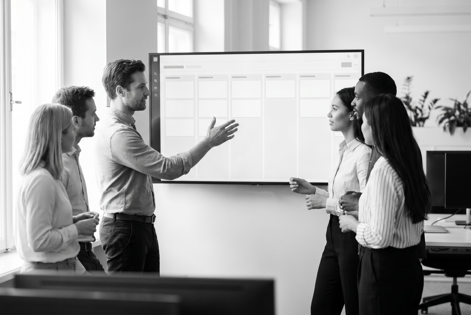 A sales and RevOps team reviewing a CRM pipeline on screen